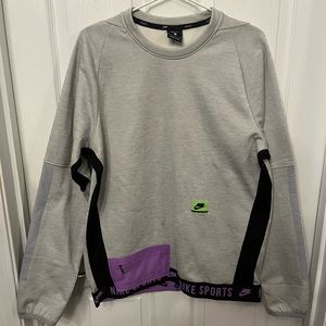 Nike Sport Clash Sweatshirt with zip pocket.